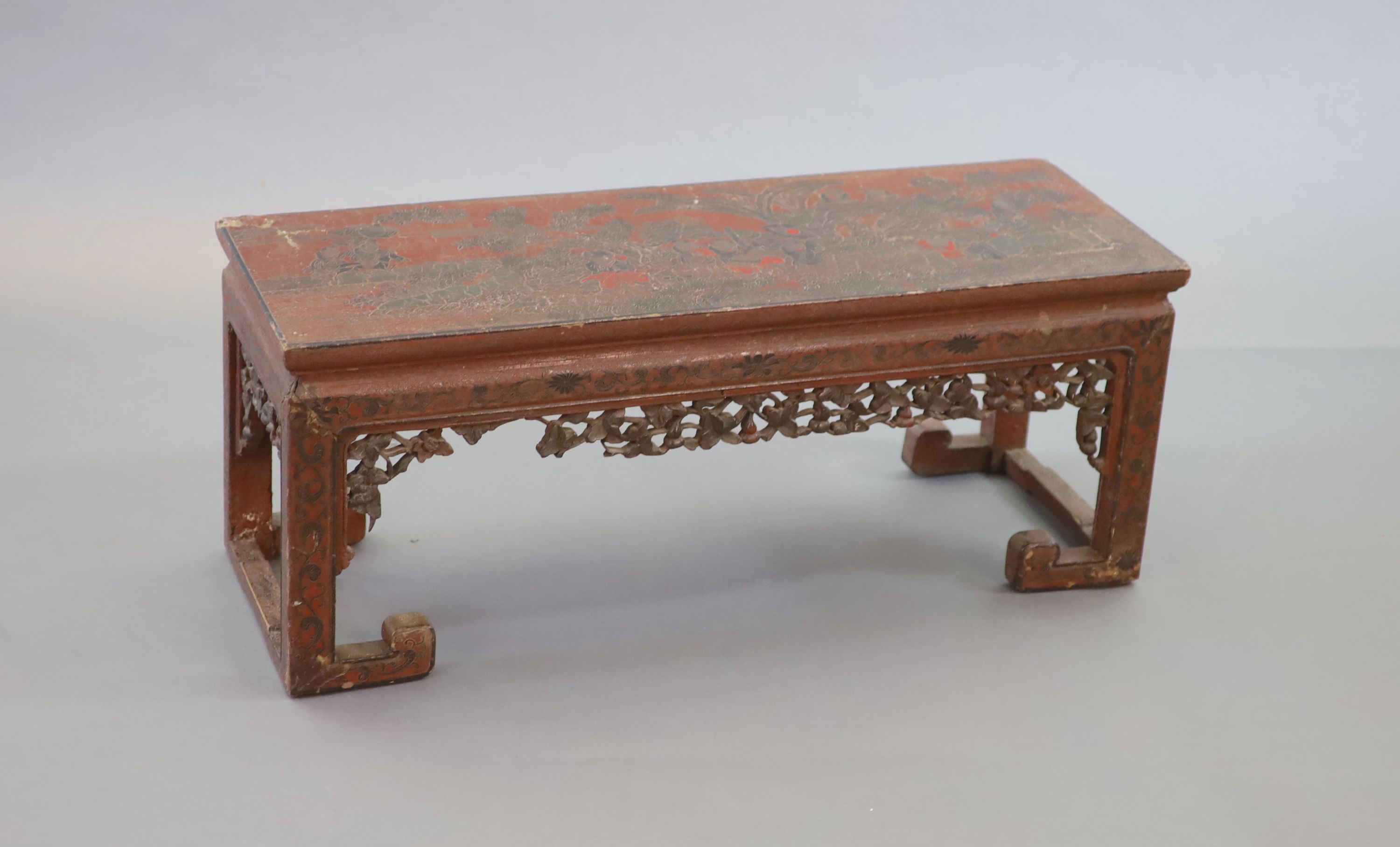 A Chinese coromandel lacquer table or stand, 18th century, 88cm long, 31.5cm long, 35cm high, losses